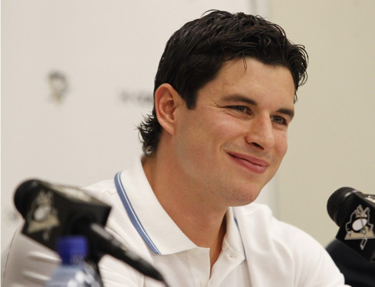 Pittsburgh Penguins&#039; Crosby smiles at a reporter&#039;s question during a news conference at Consol Energy Center in Pittsburgh