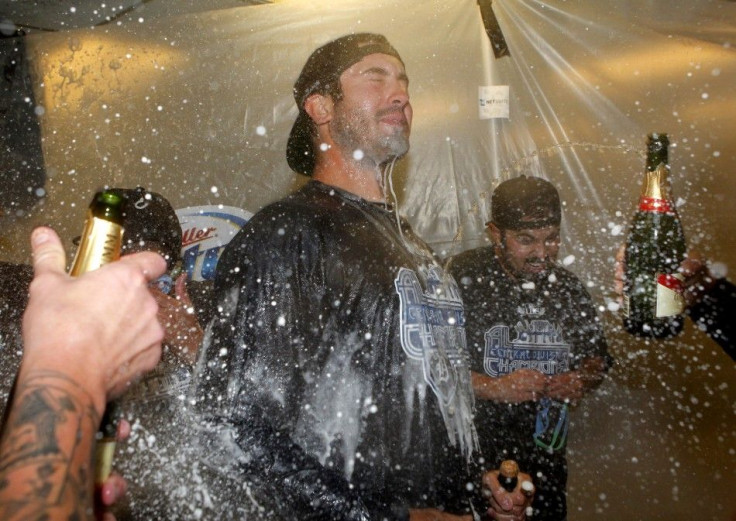 Detroit Tigers pitcher Justin Verlander celebrates in the visitor clubhouse after the Detroit Tigers clinched the American League Central Division after defeating the Oakland Athletics in Oakland