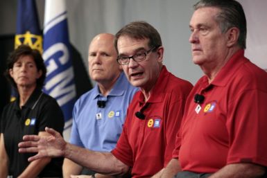 United Auto Workers Union President Bob King addresses media as GM Chairman and CEO Akerson, GM VP of Labor Relations Clegg and UAW VP UAW-GM department Ashton listen at Detroit-Hamtramck assembly plant