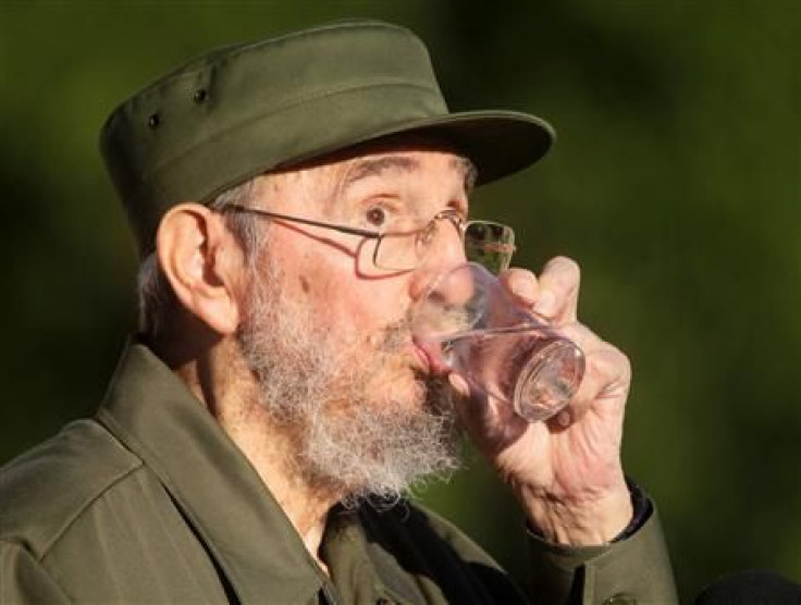 Former Cuban leader Fidel Castro drinks water during a meeting with students at Havana&#039;s University