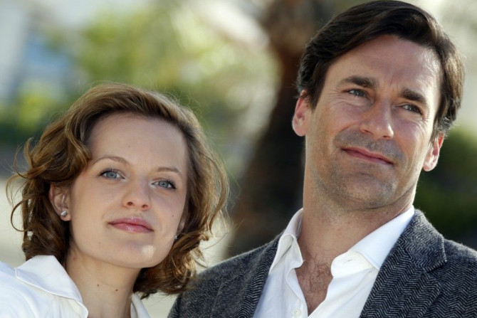 Cast members Moss and Hamm pose during a photocall to promote their television series &quot;Mad Men&quot; at the annual MIPCOM television programme market in Cannes