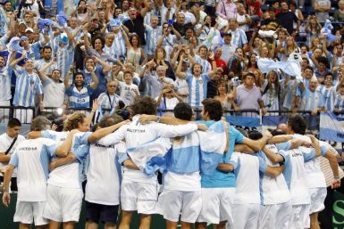 Argentina&#039;s players celebrate after beating Serbia in their Davis Cup World Group tennis semi-final match in Belgrade