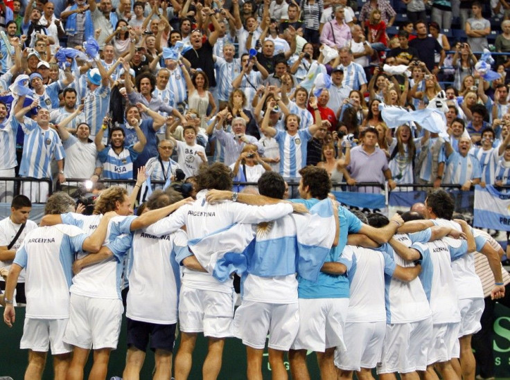 Argentina&#039;s players celebrate after beating Serbia in their Davis Cup World Group tennis semi-final match in Belgrade