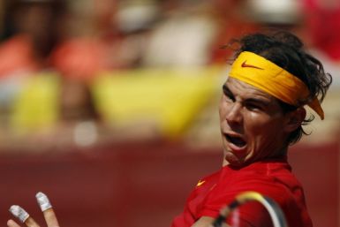 Nadal of Spain returns a shot to Tsonga of France during their Davis Cup World Group semi-final match at Cordoba bullring