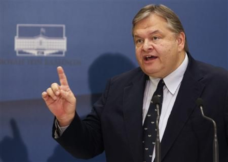 Greek Finance Minister Evangelos Venizelos addresses reporters after an unscheduled cabinet meeting in Athens