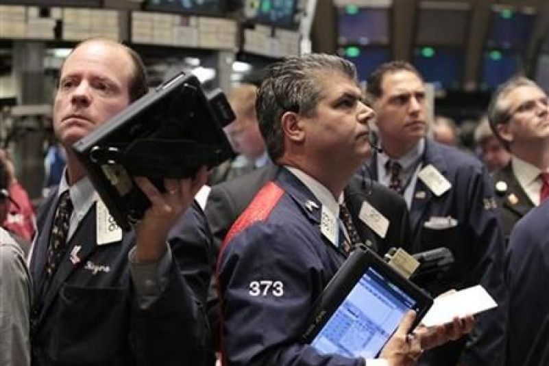 Traders work on the floor of the New York Stock Exchange