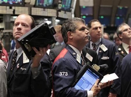 Traders work on the floor of the New York Stock Exchange