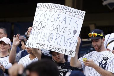Fans hold sign celebrating 602nd save of New York Yankees pitcher Rivera, a career record, at Yankee Stadium in New York