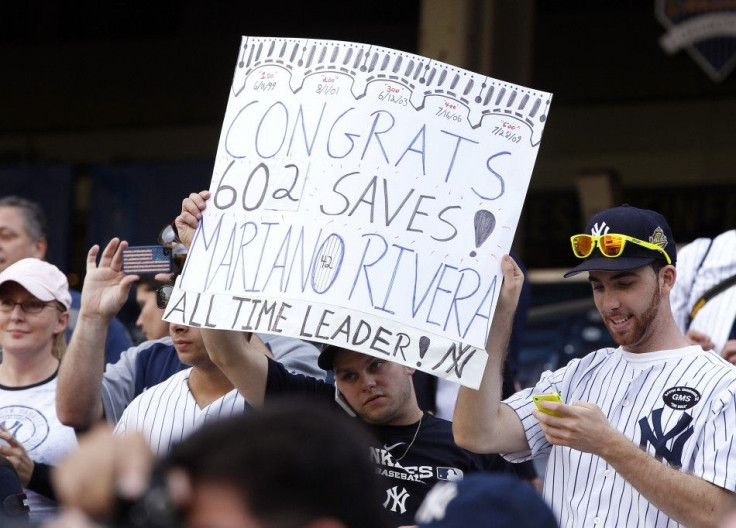 Fans hold sign celebrating 602nd save of New York Yankees pitcher Rivera, a career record, at Yankee Stadium in New York
