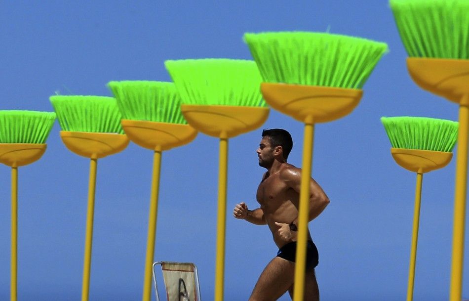 Brazilians Urge to Sweep off Corruption by Placing Brooms at a Beach