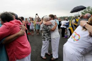 Forty six couples are wed in a large same-sex ceremony, near the brink of Niagara Falls, in Niagara Falls