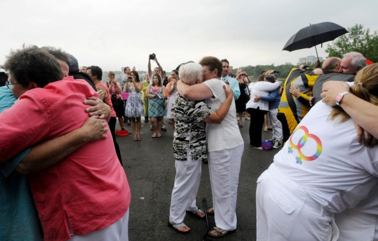 Forty six couples are wed in a large same-sex ceremony, near the brink of Niagara Falls, in Niagara Falls