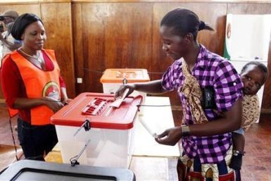 A mother casts her vote during the Zambian presidential election,