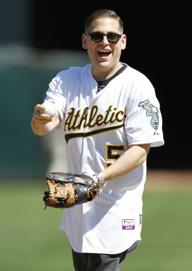 Actor Jonah Hill prepares to throw out the first pitch before the Oakland Athletics and Detroit Tigers MLB American League baseball game in Oakland, California