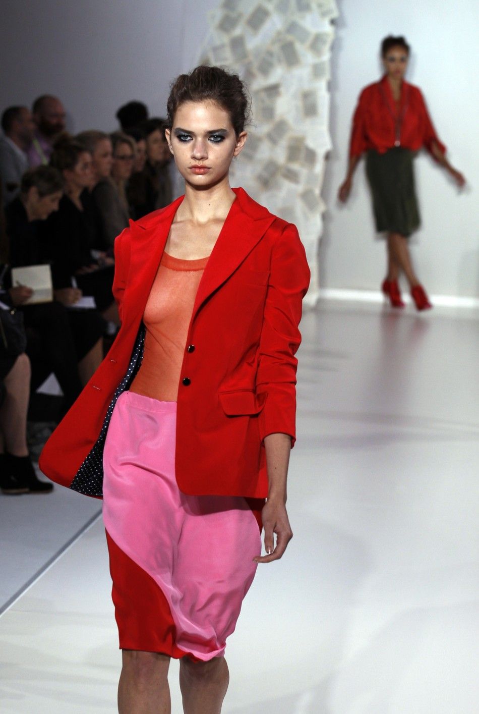 A model presents a creation from the Kinder Aggugini 2012 SpringSummer collection during London Fashion Week