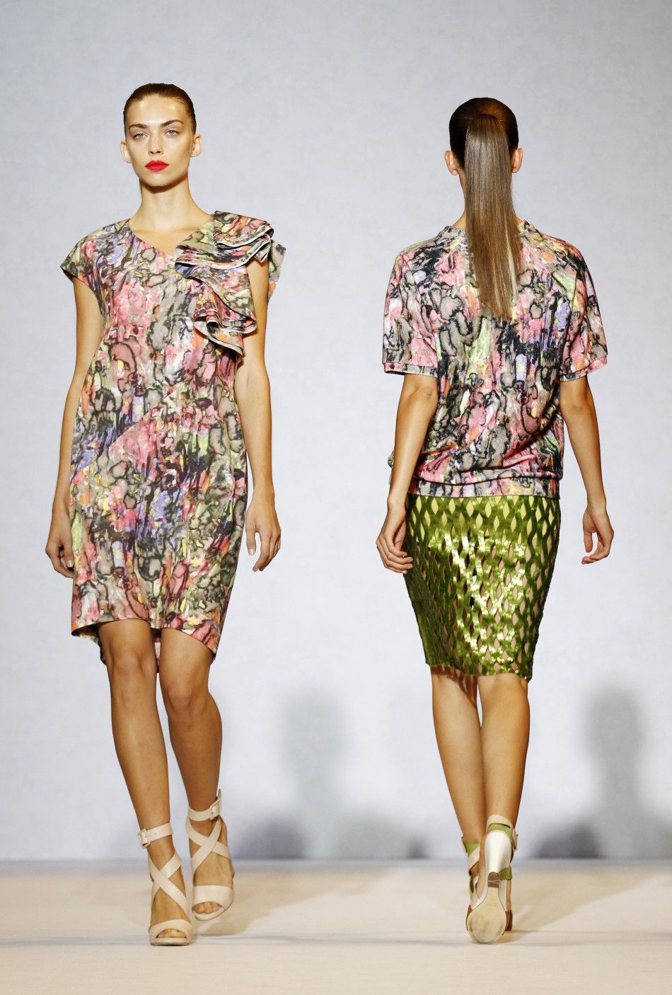 Models wear creations by Nicole Farhi at her 2012 SpringSummer collection show during London Fashion Week