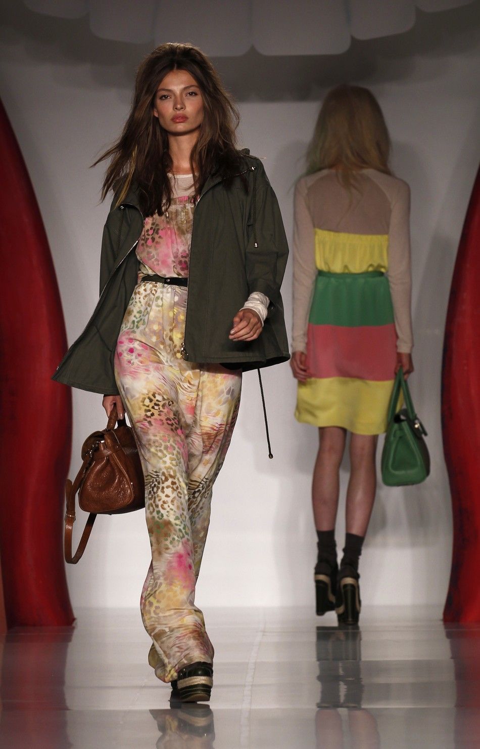 Models present creations from the Mulberry 2012 SpringSummer collection during London Fashion Week