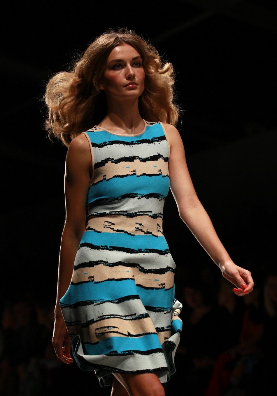 A model presents a creation from the Issa 2012 SpringSummer collection during London Fashion Week