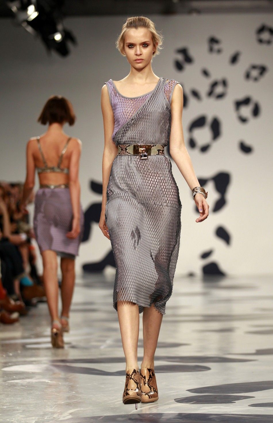 Models present creations at the House of Holland 2012 SpringSummer collection during London Fashion Week