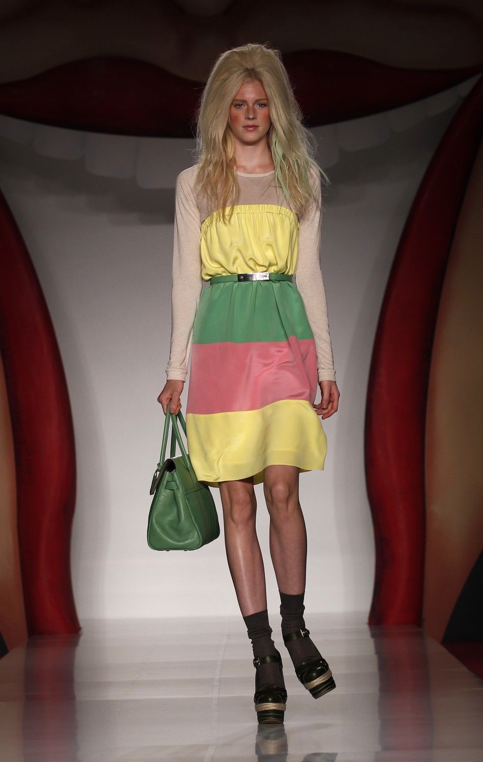 A model presents a creation from the Mulberry 2012 SpringSummer collection during London Fashion Week