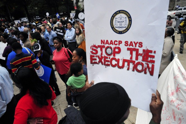 Protesters show their support for death row inmate Troy Davis during a rally at the capitol in Atlanta