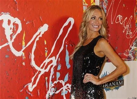 Taylor Armstrong, from the Bravo reality TV series 'The Real Housewives of Beverly Hills', arrives at the unveiling of artist Jack Armstrong's 'Cosmic Starship' Harley-Davidson motorcycle at Bartels Harley-Davidson in Marina Del R