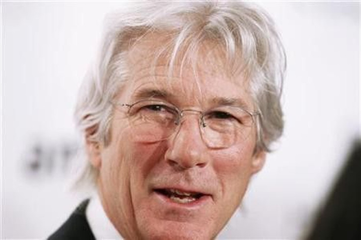 Richard Gere arrives to attend the amfAR New York Gala which begins Fall 2011 Fashion Week in New York