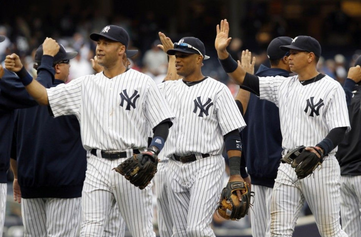 Yankees players Jeter Cano and Rodriguez celebrate after the Yankees defeated Tampa Bay Rays in their MLB American League baseball game in New York