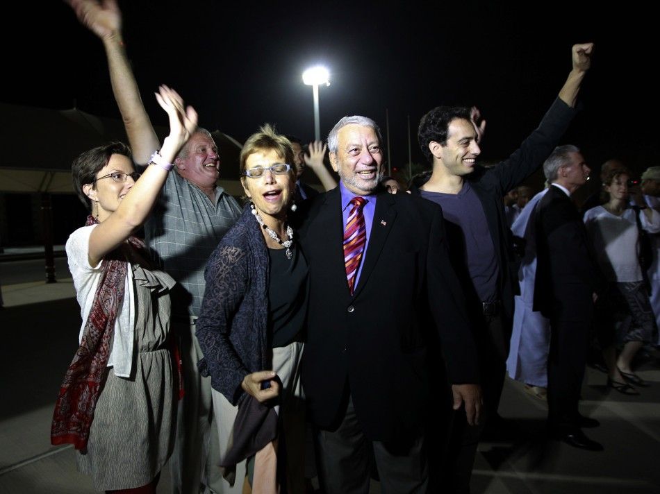 Sarah Shourd, Laura Fattal and relatives wave to Josh Fattal and Shane Bauer, U.S. hikers who were held in Iran on charges of espionage, during their arrival in Muscat, after their release from Tehrans Evin prison