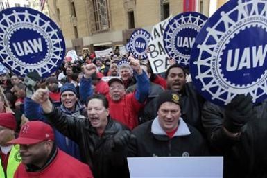 United Auto Workers convention delegates chant during a rally for good jobs and tax reform following a UAW convention in Detroit, Michigan, in this March 24, 2011 file photo.