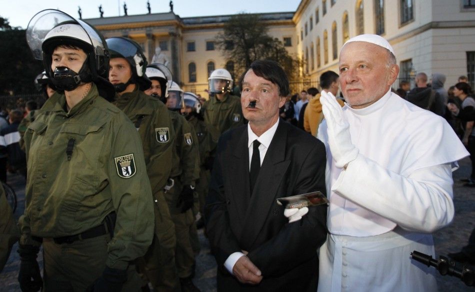 Artist opposing the visit of Pope Benedict XVI dresses like the pope during a protest in Berlin