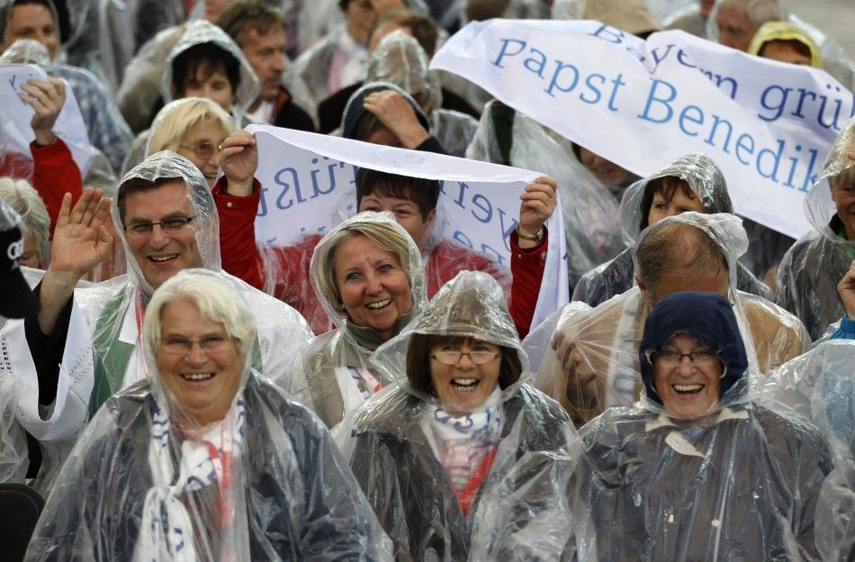 Faithful cheer as they await Pope Benedict to lead Holy Eucharist celebration at Olympic stadium in Berlin