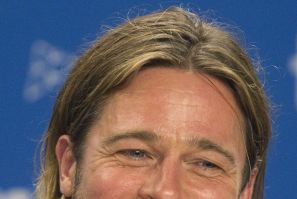 Actor Brad Pitt smiles during news conference for the film Moneyball at the 36th Toronto International Film Festival in Toronto