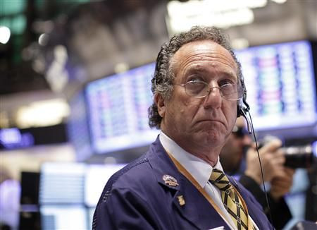 Traders work on the floor of the New York Stock Exchange