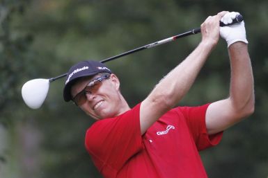 Senden of Australia hits off the fourth tee during round one of the Tour Championship PGA golf tournament in Atlanta.