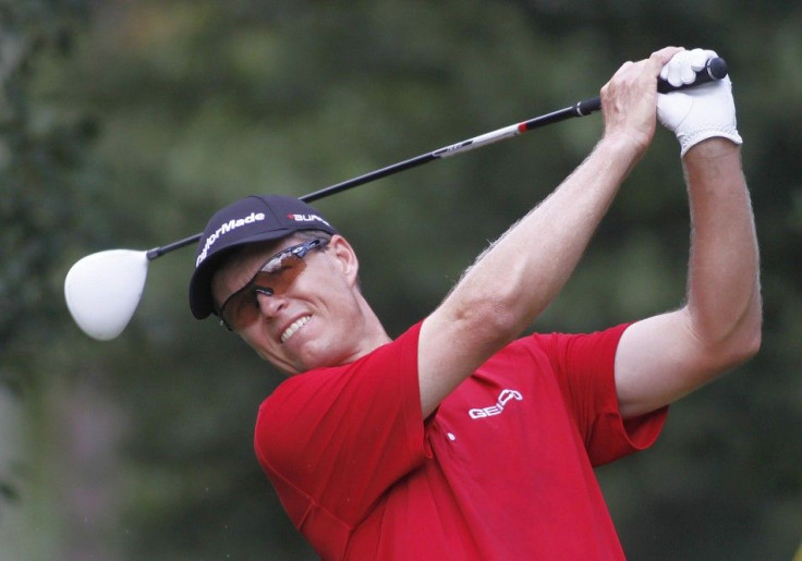 Senden of Australia hits off the fourth tee during round one of the Tour Championship PGA golf tournament in Atlanta.