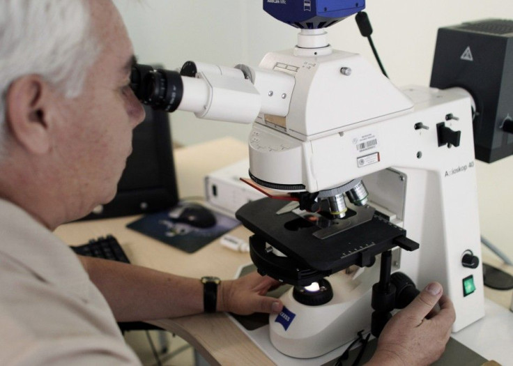 Forensic Jose Luis Ramirez works a DNA sample to help identify the corpses in Mexican forensic building in Mexico City