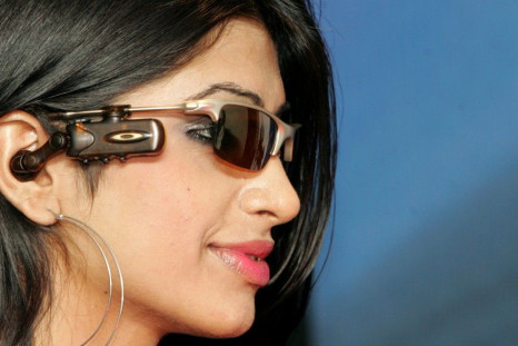 A model poses with Motorola&#039;s O ROKR bluetooth stereo eyewear during its launch in New Delhi