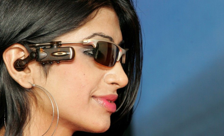 A model poses with Motorola&#039;s O ROKR bluetooth stereo eyewear during its launch in New Delhi
