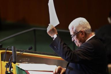 Palestinian Authority president Mahmoud Abbas holds up a letter to United Nations Secretary General Ban Ki-Moon requesting Palestinian statehood at the 66th United Nations General Assembly at U.N. headquarters in New York