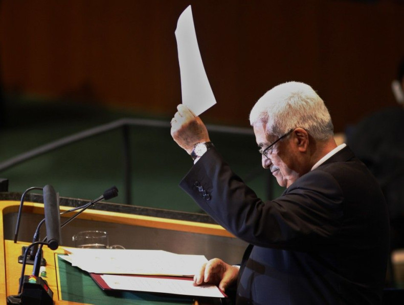 Palestinian Authority president Mahmoud Abbas holds up a letter to United Nations Secretary General Ban Ki-Moon requesting Palestinian statehood at the 66th United Nations General Assembly at U.N. headquarters in New York