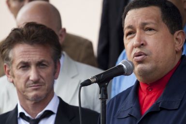 Venezuelan President Hugo Chavez speaks to the media as he stands next to the U.S. actor Sean Penn after their meeting at Miraflores Palace in Caracas