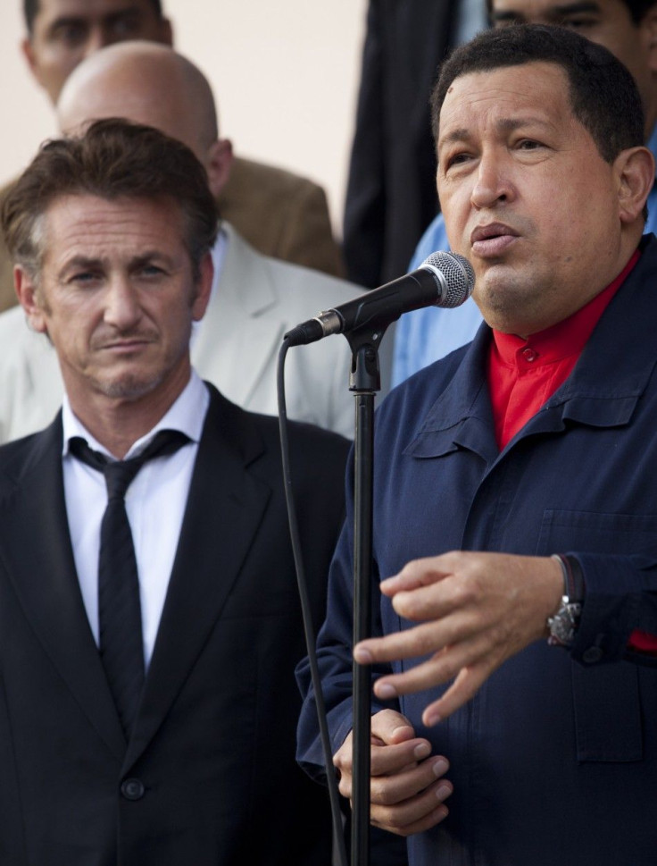 Venezuelan President Hugo Chavez speaks to the media as he stands next to the U.S. actor Sean Penn after their meeting at Miraflores Palace in Caracas