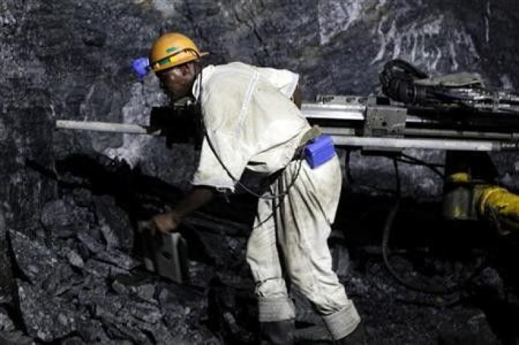 A mine worker is seen underground in South Deep mine outside Johannesburg 