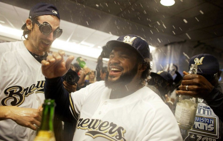Milwaukee Brewers&#039; Prince Fielder and John Axford along with the rest of the team celebrate in the locker room in Milwaukee