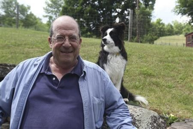 Author Jon Katz poses for a picture with a dog in this publicity photo released to Reuters