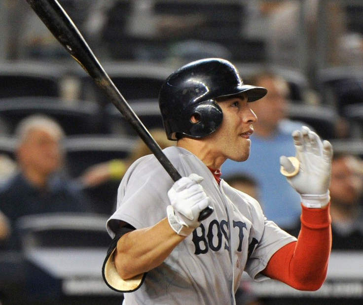Red Sox batter Ellsbury watches the ball as he follows through on his swing after he hit a three-run home run against the Yankees in the 14th inning of the second MLB American League baseball game in New York