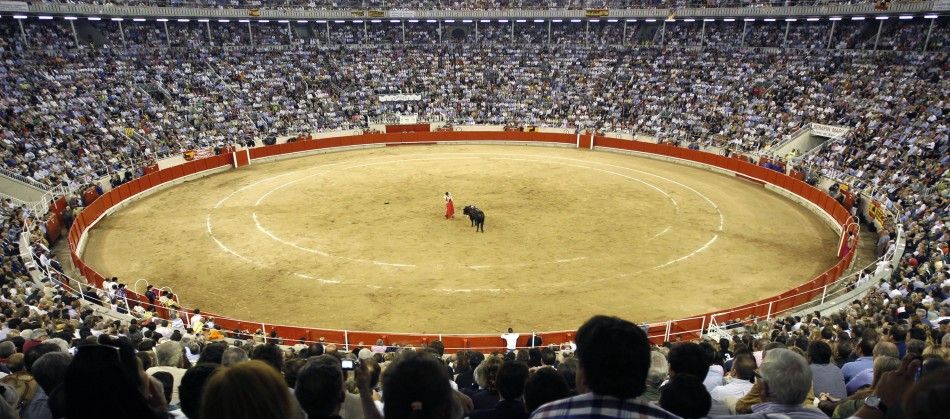 Spanish bullfighter Serafin Martin performs a pass to a bull during the last bullfight