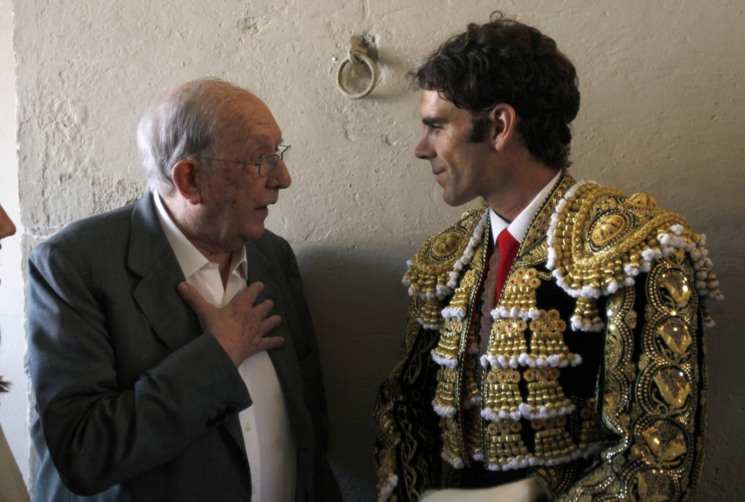 Spanish bullfighter Jose Tomas speaks with Pedro Balana, owner of La Monumental bullring, before the last bullfight in central Barcelona