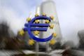 A euro sculpture is pictured in front of the headquarter of the European Central Bank (ECB) in Frankfurt